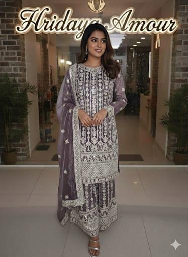Model in an amethyst printed festive kurta set with matching dupatta